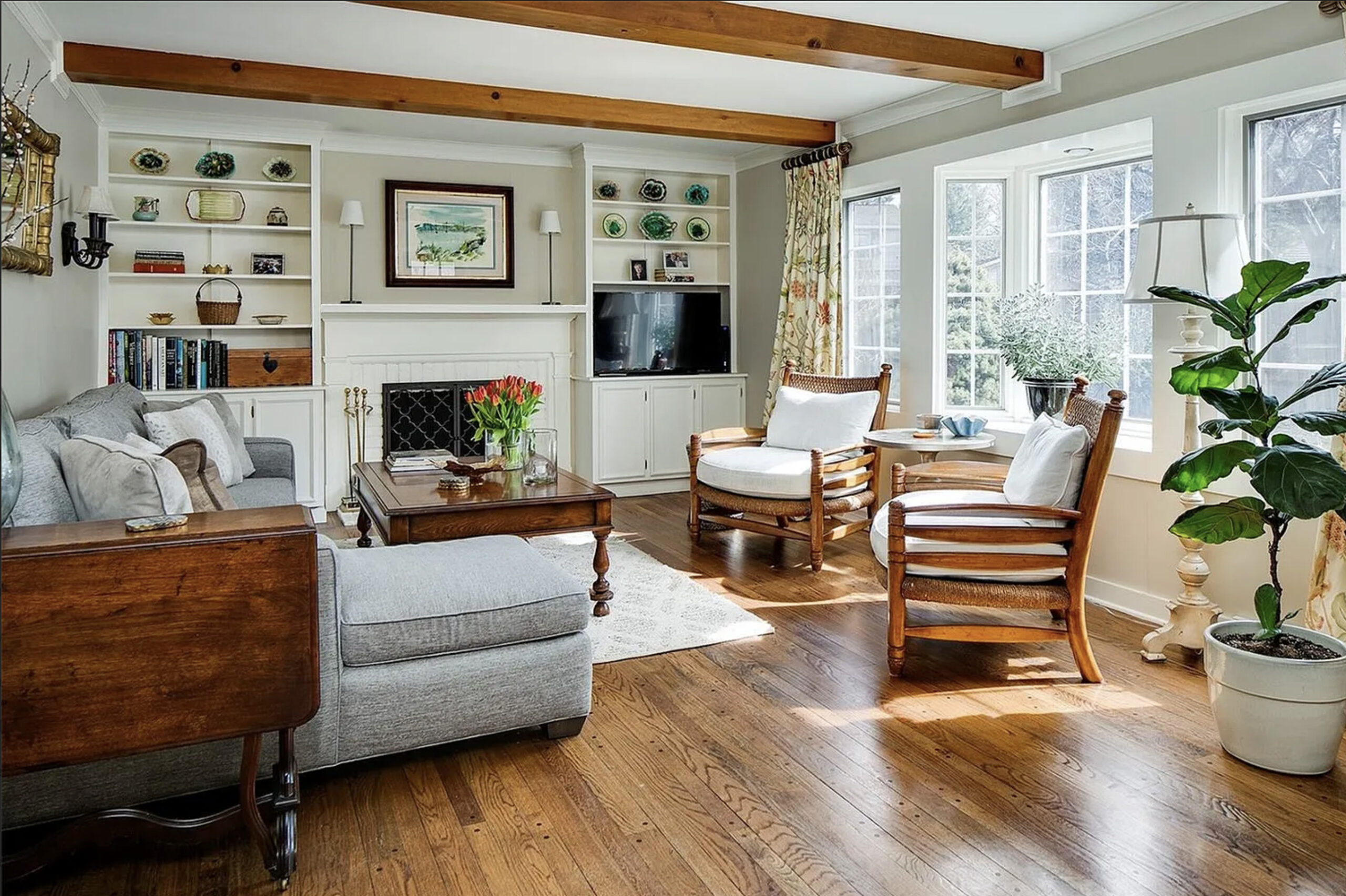 Erickson Interior Designs - Living room with picture window and fireplace